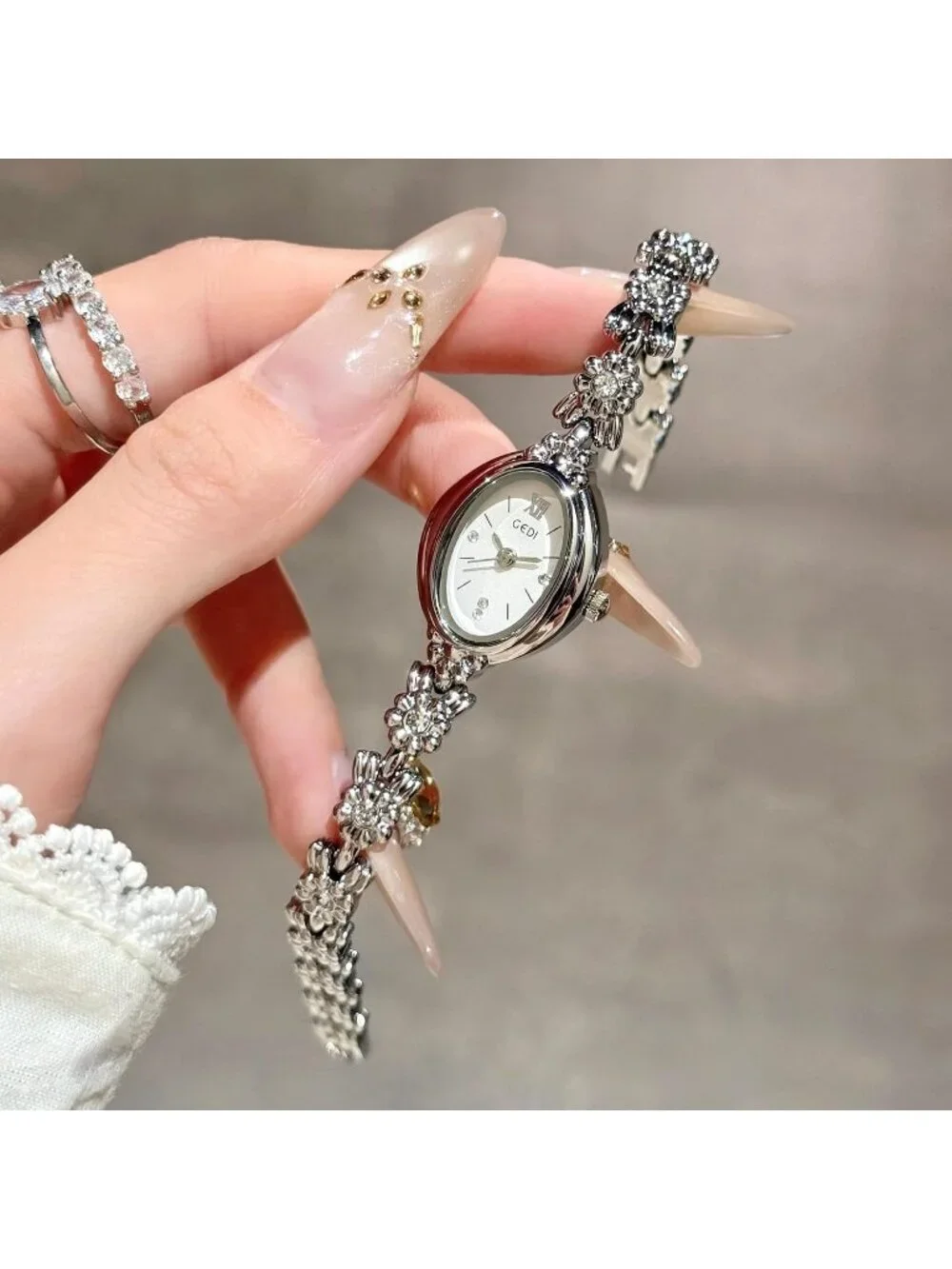 Women's White Silver Analog Quartz Alloy Steel Oval Roman Numeral Bracelet Watch